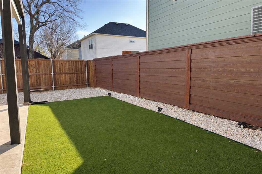 3121 Rutz Street Dallas, TX 75212 - Photo 24 of 24 a view of a backyard with wooden fence