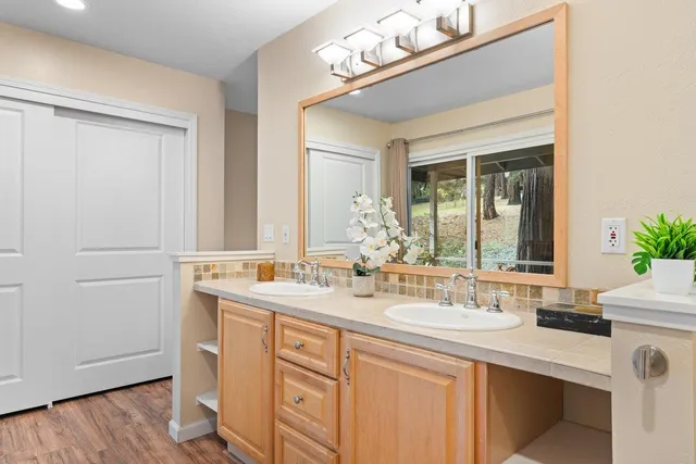 a bathroom with a sink and a mirror