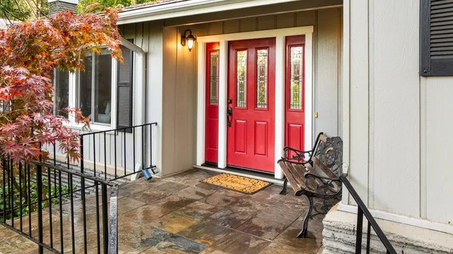 a view of a house with backyard and porch