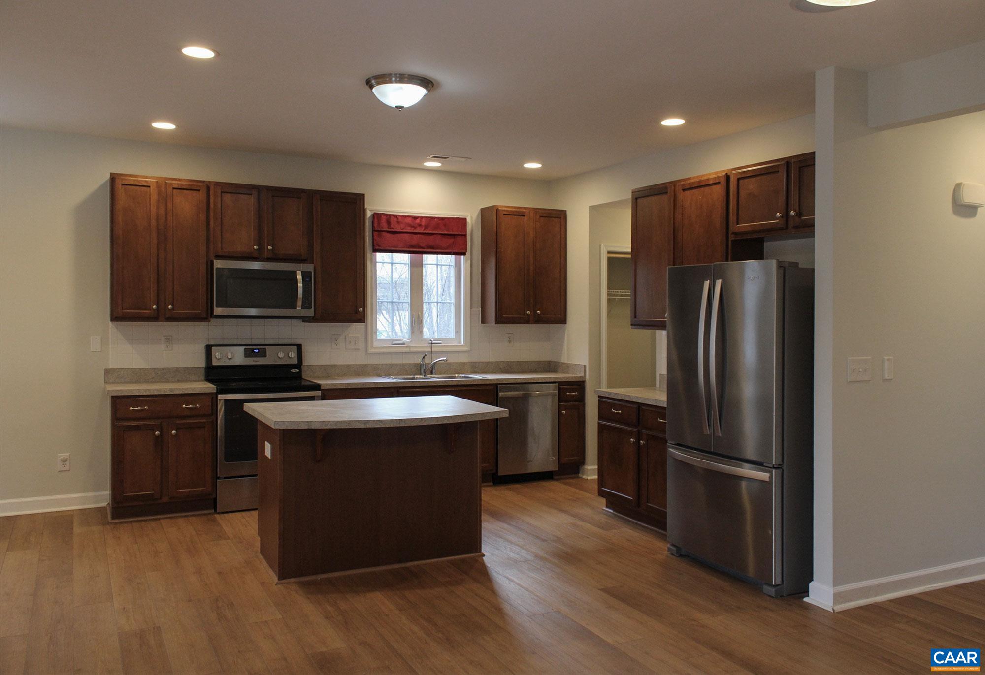 5335 Brookwood Road Crozet, VA 22932 - Photo 11 of 29 a kitchen with stainless steel appliances granite countertop a refrigerator stove and microwave