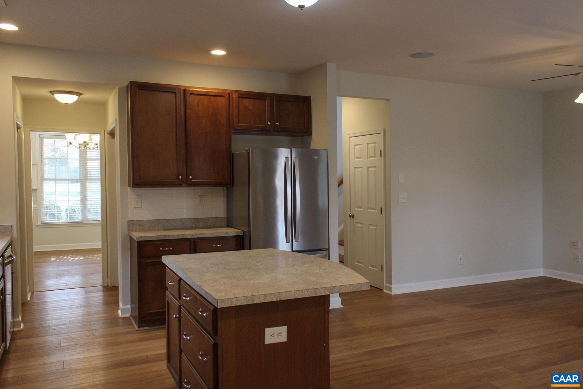 5335 Brookwood Road Crozet, VA 22932 - Photo 14 of 29 a kitchen with a refrigerator a sink and wooden floor