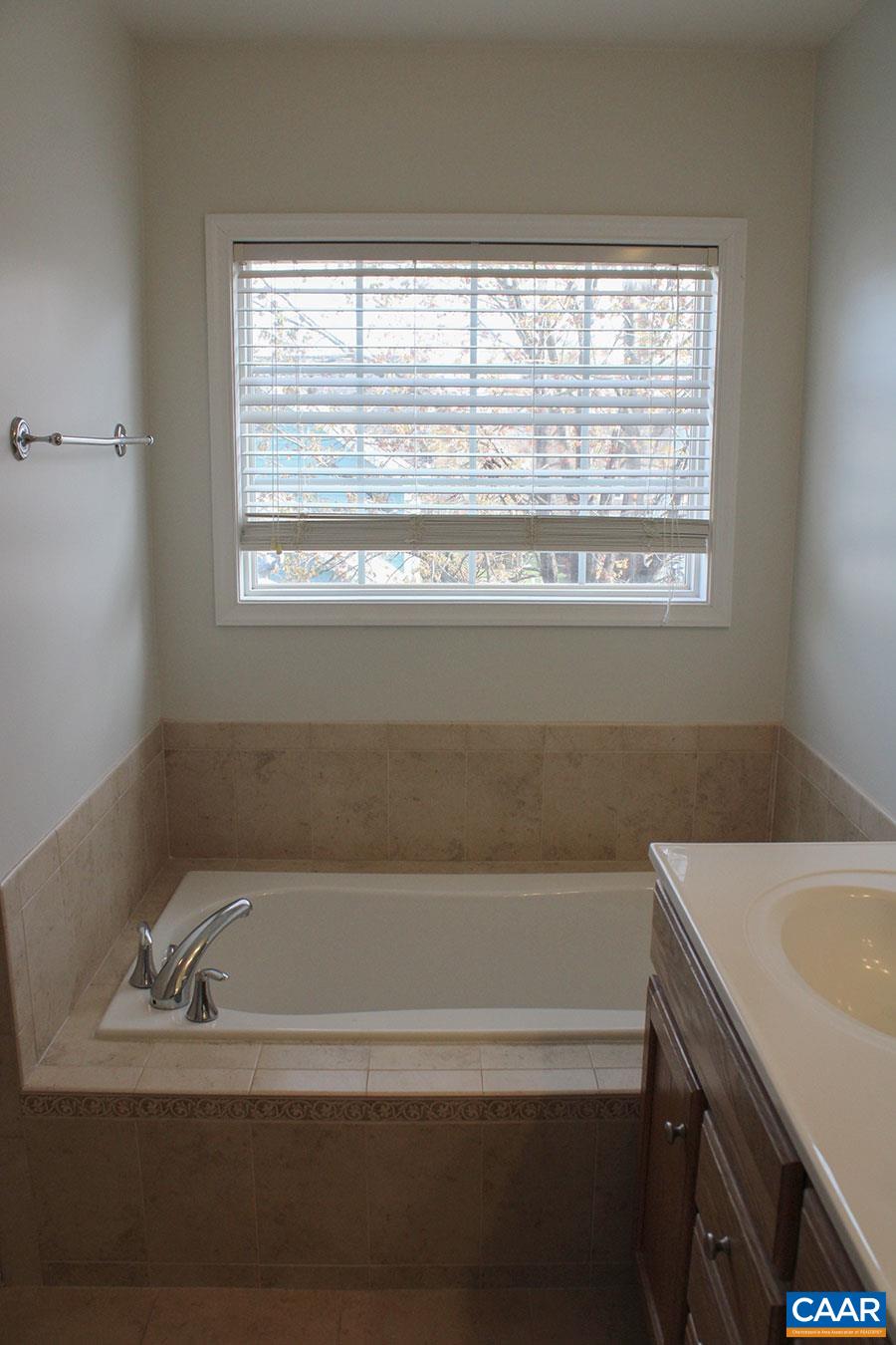 5335 Brookwood Road Crozet, VA 22932 - Photo 20 of 29 a bathroom with a bathtub and a window