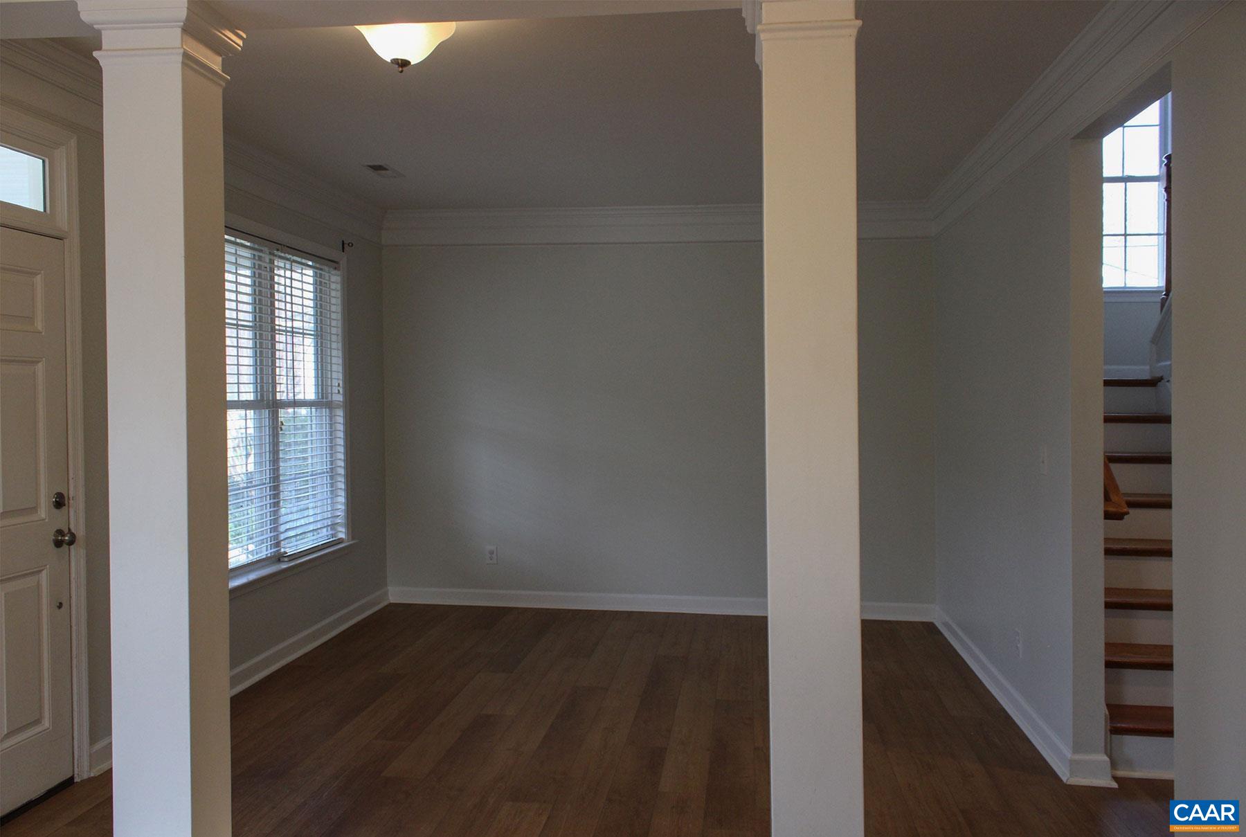 5335 Brookwood Road Crozet, VA 22932 - Photo 5 of 29 a view of an empty room with wooden floor and a window