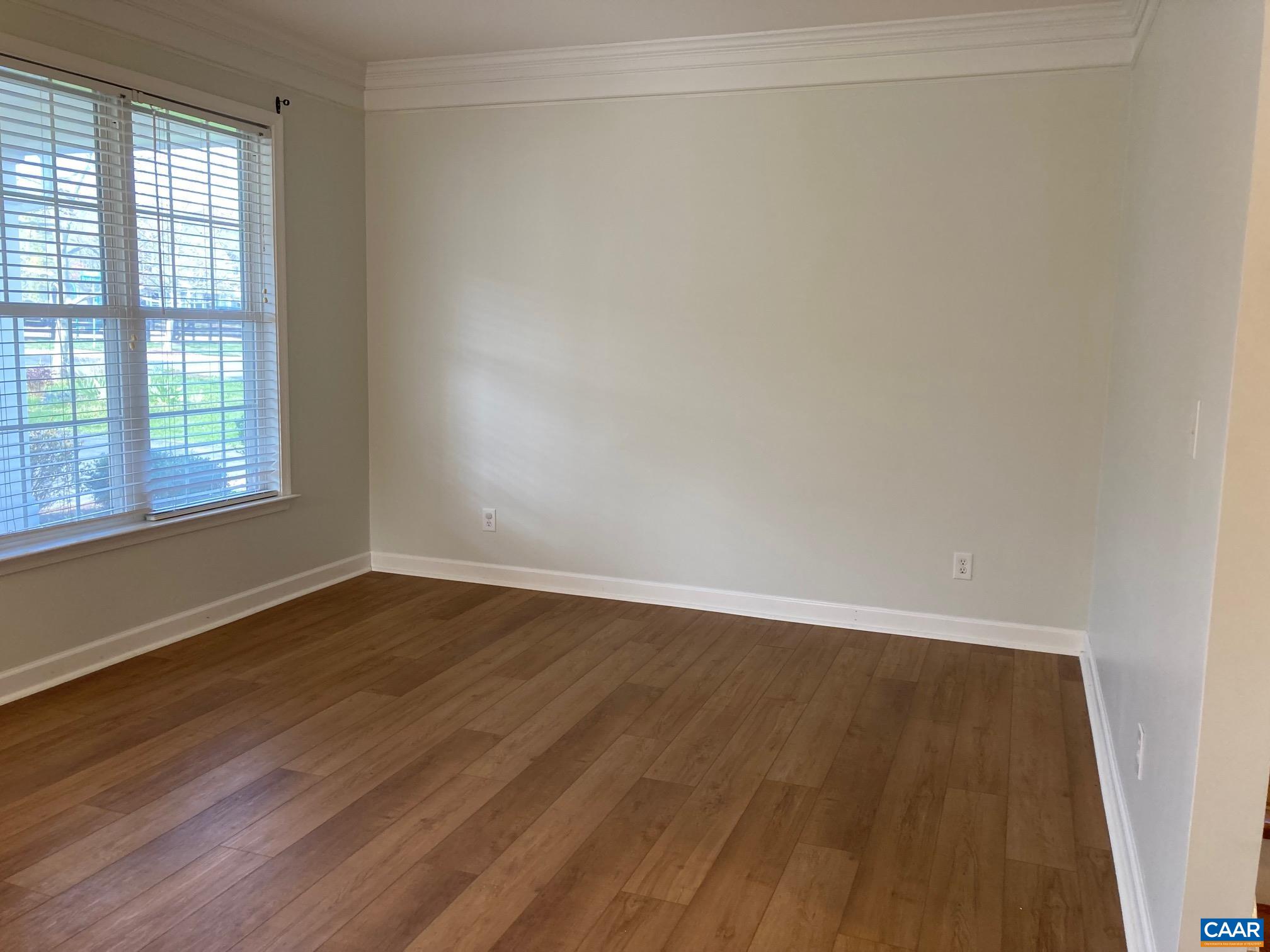 5335 Brookwood Road Crozet, VA 22932 - Photo 6 of 29 a view of an empty room with wooden floor and a window