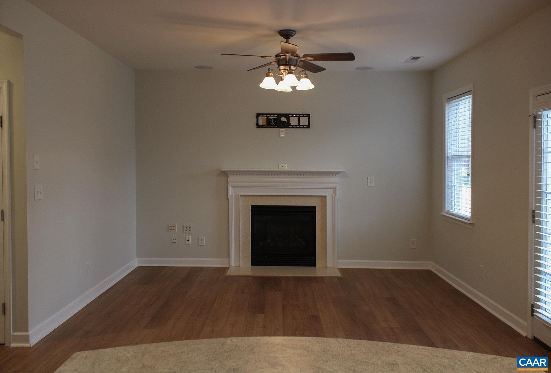 5335 Brookwood Road Crozet, VA 22932 - Photo 8 of 29 a view of an empty room with wooden floor and a window