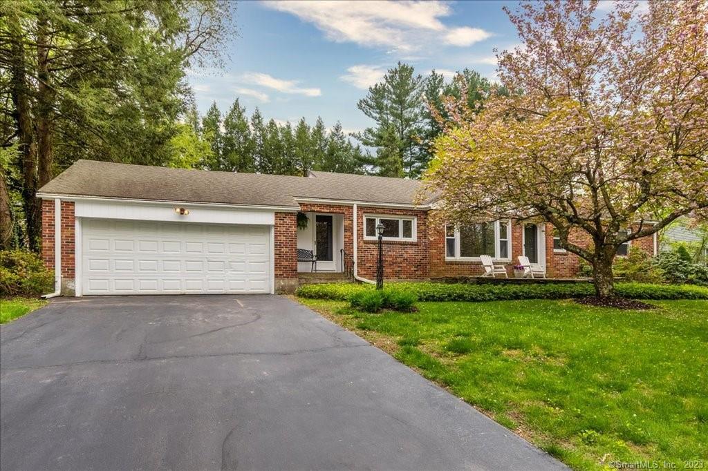 7 Still Road West Hartford, CT 06117 - Photo 1 of 1 a front view of a house with garden