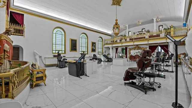 a view of a livingroom with furniture and a gym equipment