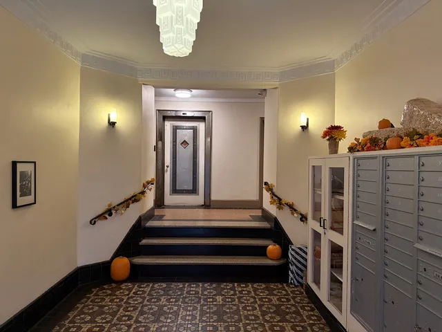 a bathroom with a sink a mirror a potted plant and a shower