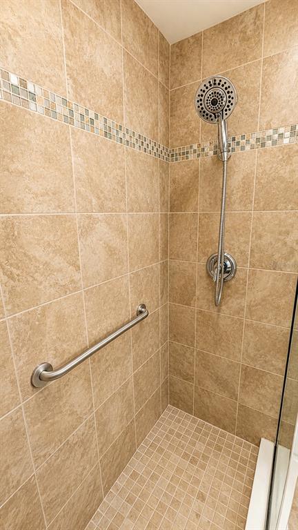 6552 Moorings Point Circle, Unit 102 Lakewood Ranch, FL 34202 - Photo 34 of 57 a bathroom with a shower