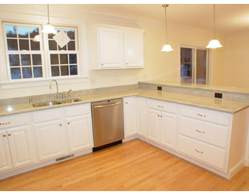 42 South Hampton Road Amesbury, MA 01913 - Photo 4 of 14 a kitchen with a sink cabinets and window