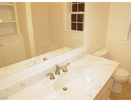 42 South Hampton Road Amesbury, MA 01913 - Photo 10 of 14 a bathroom with a tub sink and vanity