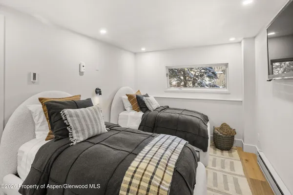 a bathroom with double vanity sink and a mirror