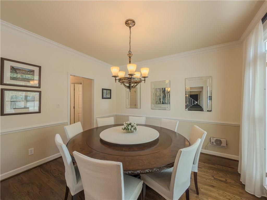 4284 Cedar Bluff Way Southwest Lilburn, GA 30047 - Photo 32 of 62 a dining room with furniture and chandelier