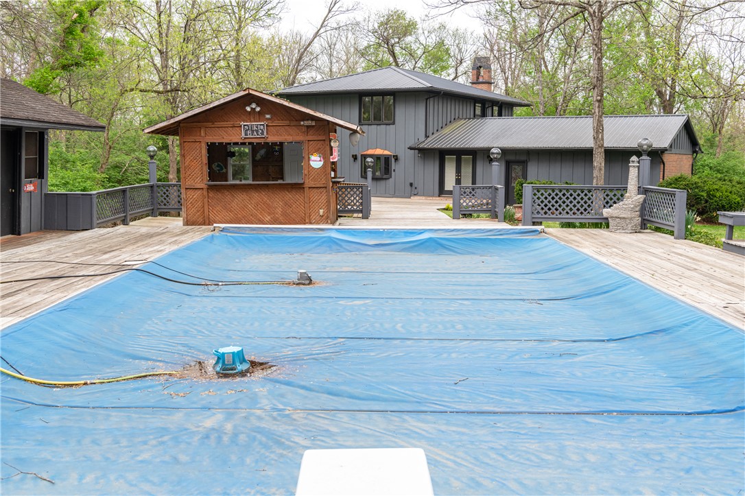 6750 Little Twin Road Germantown, OH 45327 - Photo 45 of 88 An inviting outdoor oasis features a private pool and a charming tiki bar, perfect for entertaining.