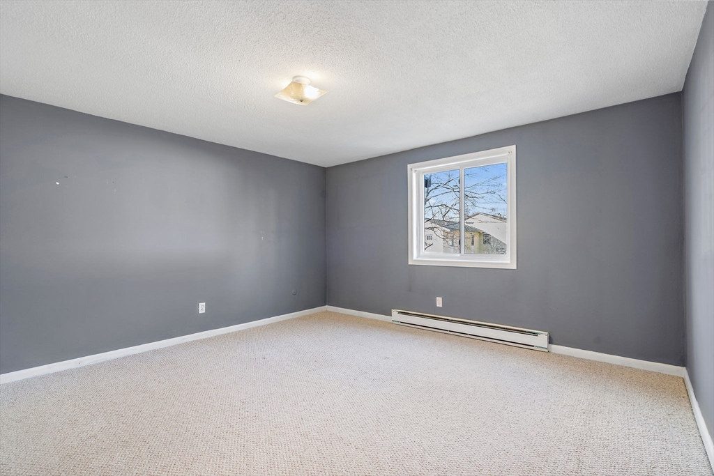 35 High Street, Unit 9 Marlborough, MA 01752 - Photo 17 of 25 an empty room with windows