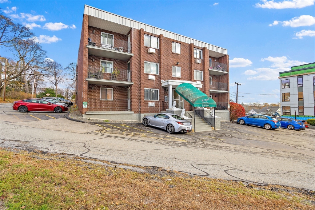 35 High Street, Unit 9 Marlborough, MA 01752 - Photo 23 of 25 a view of a cars parked in front of a house