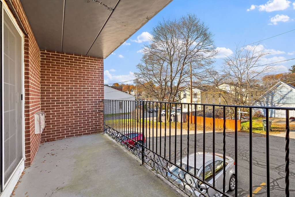 35 High Street, Unit 9 Marlborough, MA 01752 - Photo 8 of 25 a view of a wrought iron fences in front of house