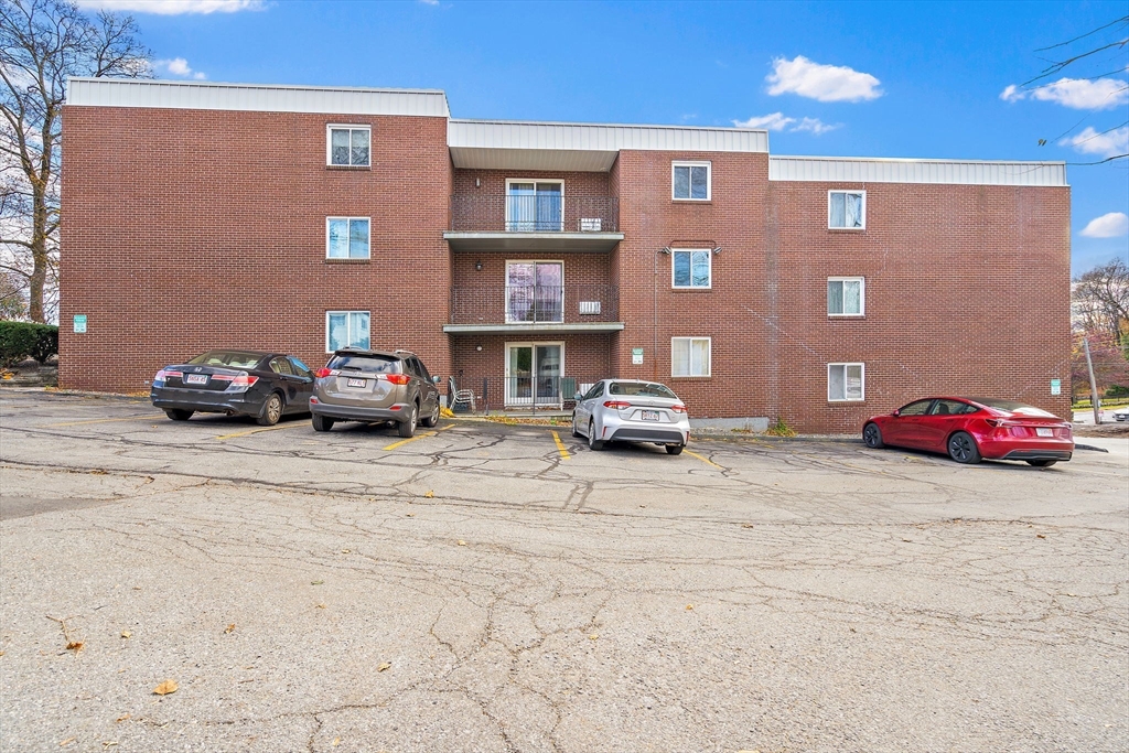 35 High Street, Unit 9 Marlborough, MA 01752 - Photo 9 of 25 a car parked in front of a building