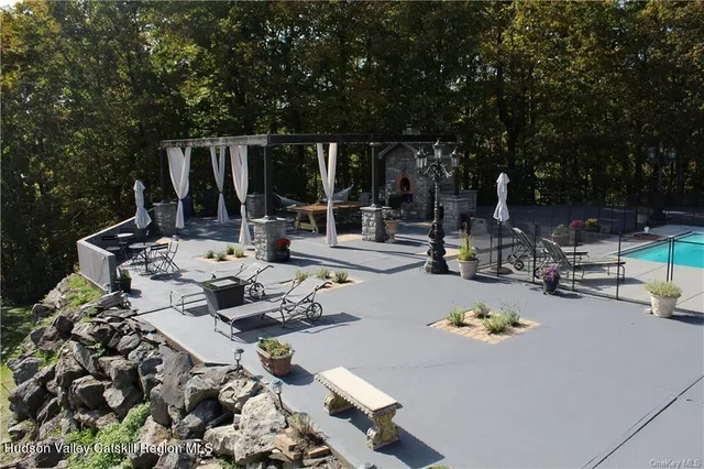 a front view of a house with outdoor seating