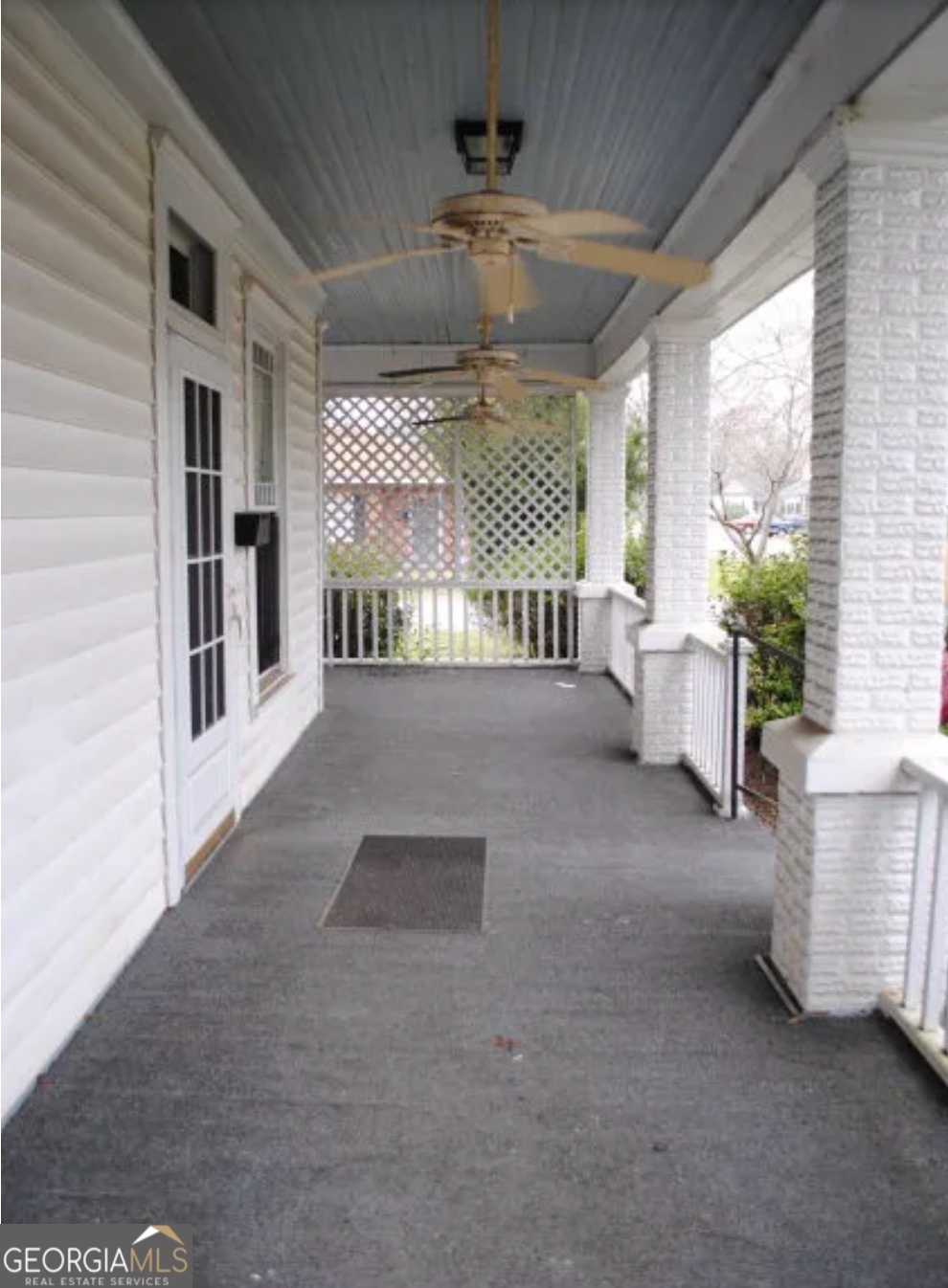 516 West Altamaha Street Fitzgerald, GA 31750 - Photo 17 of 17 a living room with furniture and a chandelier