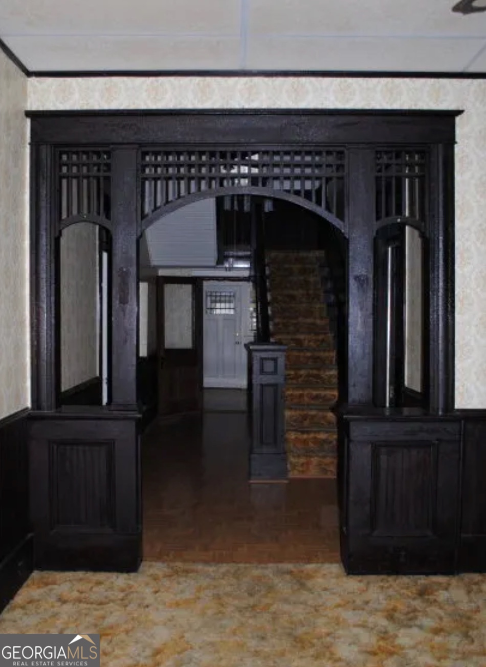 516 West Altamaha Street Fitzgerald, GA 31750 - Photo 4 of 17 front view of a hallway with wooden floor