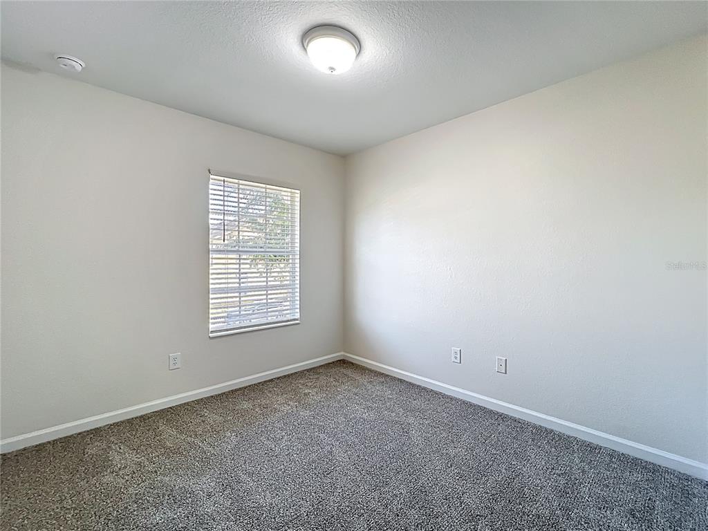 12930 Vennetta Way Windermere, FL 34786 - Photo 22 of 38 an empty room with a window
