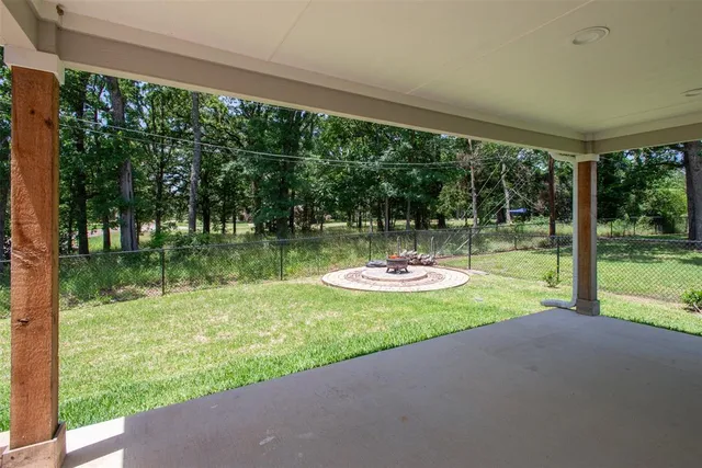 a view of swimming pool from a big yard