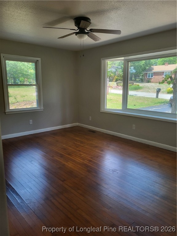 182 Summerhill Road Fayetteville, NC 28303 - Photo 12 of 24 a view of an empty room with wooden floor and a window