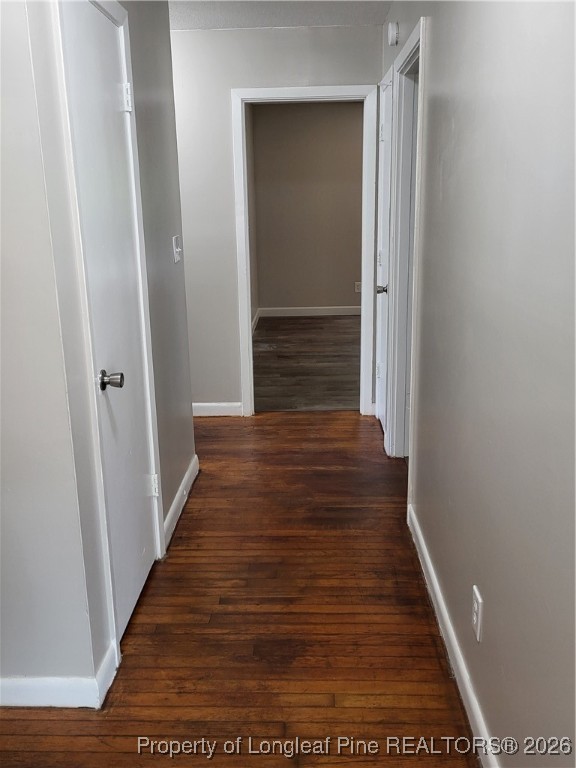 182 Summerhill Road Fayetteville, NC 28303 - Photo 14 of 24 a view of a hallway with wooden floor and staircase