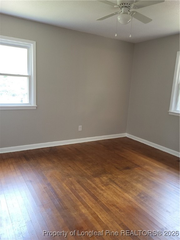 182 Summerhill Road Fayetteville, NC 28303 - Photo 19 of 24 an empty room with wooden floor and windows