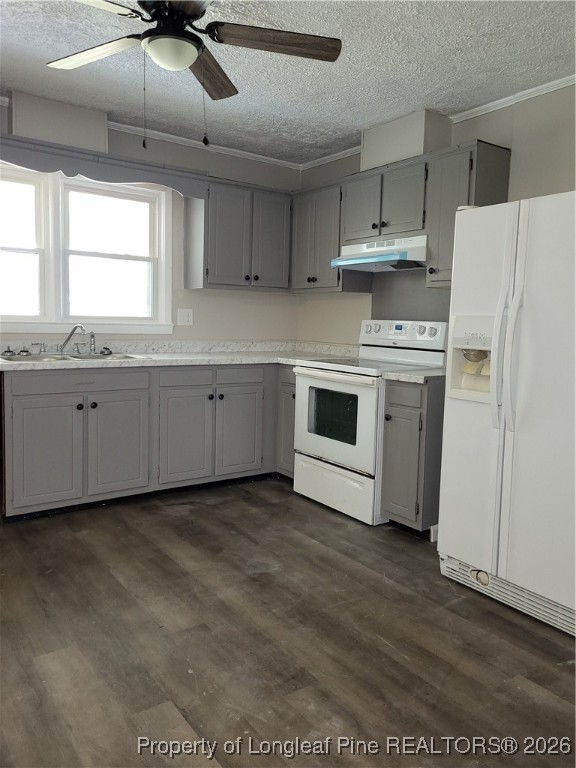 182 Summerhill Road Fayetteville, NC 28303 - Photo 7 of 24 a kitchen with granite countertop white cabinets and white appliances