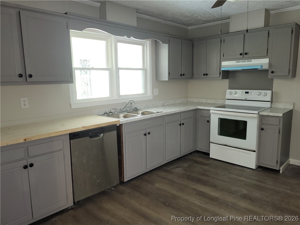 182 Summerhill Road Fayetteville, NC 28303 - Photo 9 of 24 a kitchen with cabinets appliances a sink and a window