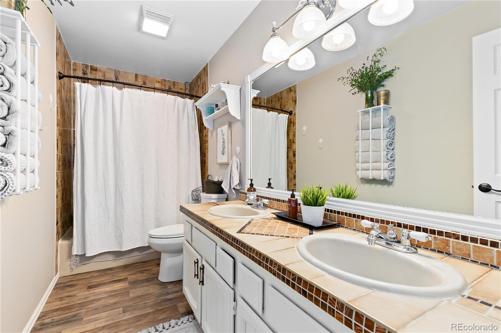 278 Overlook Drive Bailey, CO 80421 - Photo 13 of 37 a bathroom with double vanity sinks and a mirror