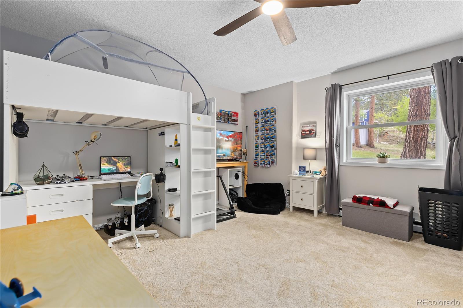 278 Overlook Drive Bailey, CO 80421 - Photo 18 of 37 a view of a workspace with furniture and a window