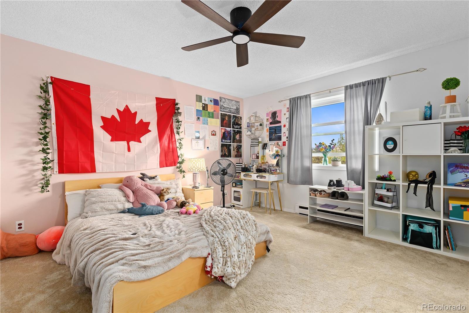 278 Overlook Drive Bailey, CO 80421 - Photo 19 of 37 a bedroom with a bed furniture and a chandelier