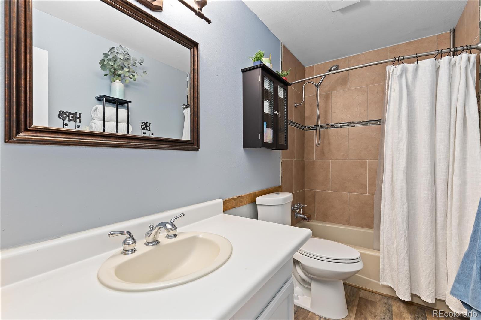 278 Overlook Drive Bailey, CO 80421 - Photo 20 of 37 a bathroom with a sink a toilet and shower