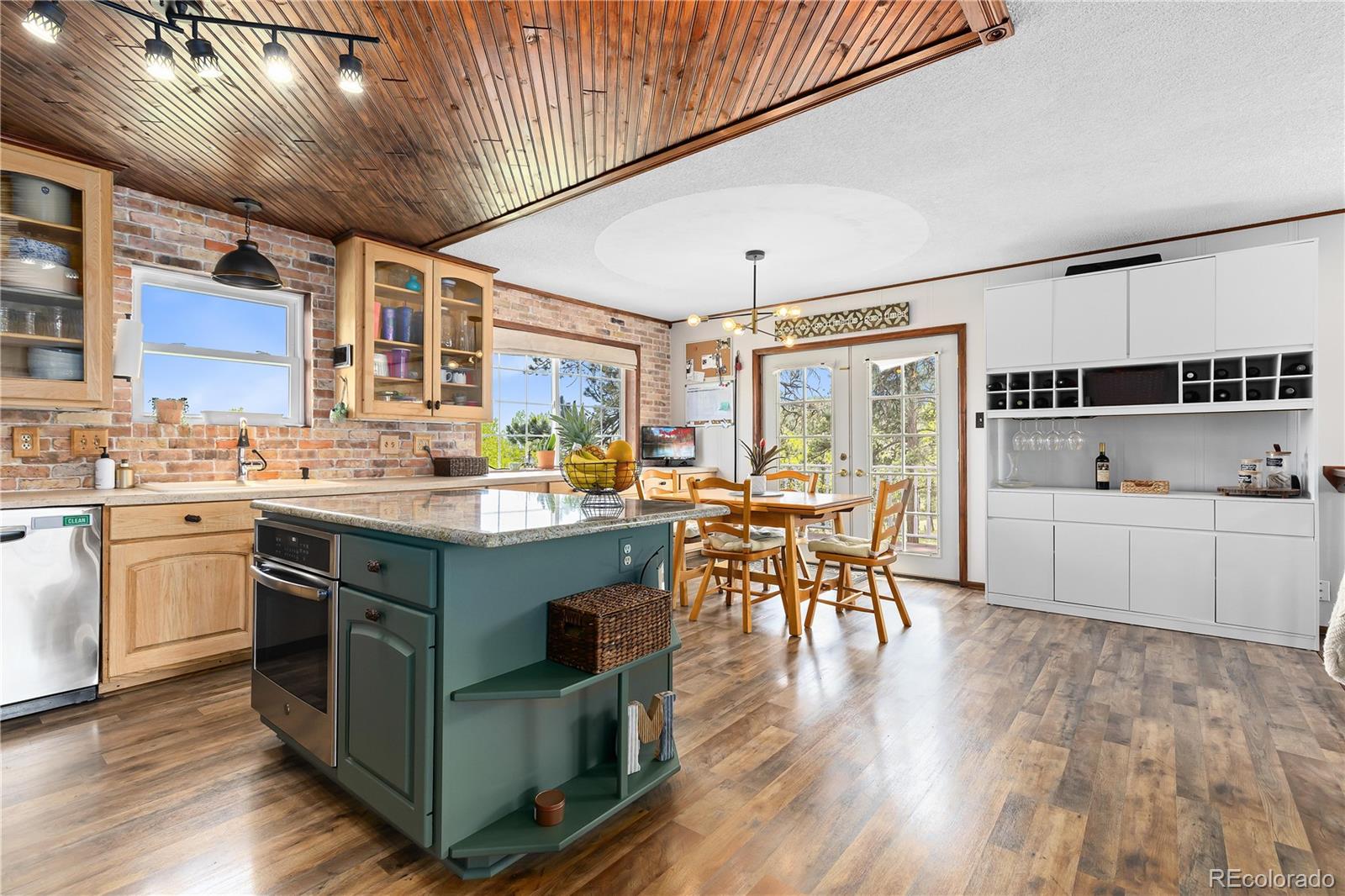 278 Overlook Drive Bailey, CO 80421 - Photo 6 of 37 a kitchen with a table chairs stove and cabinets