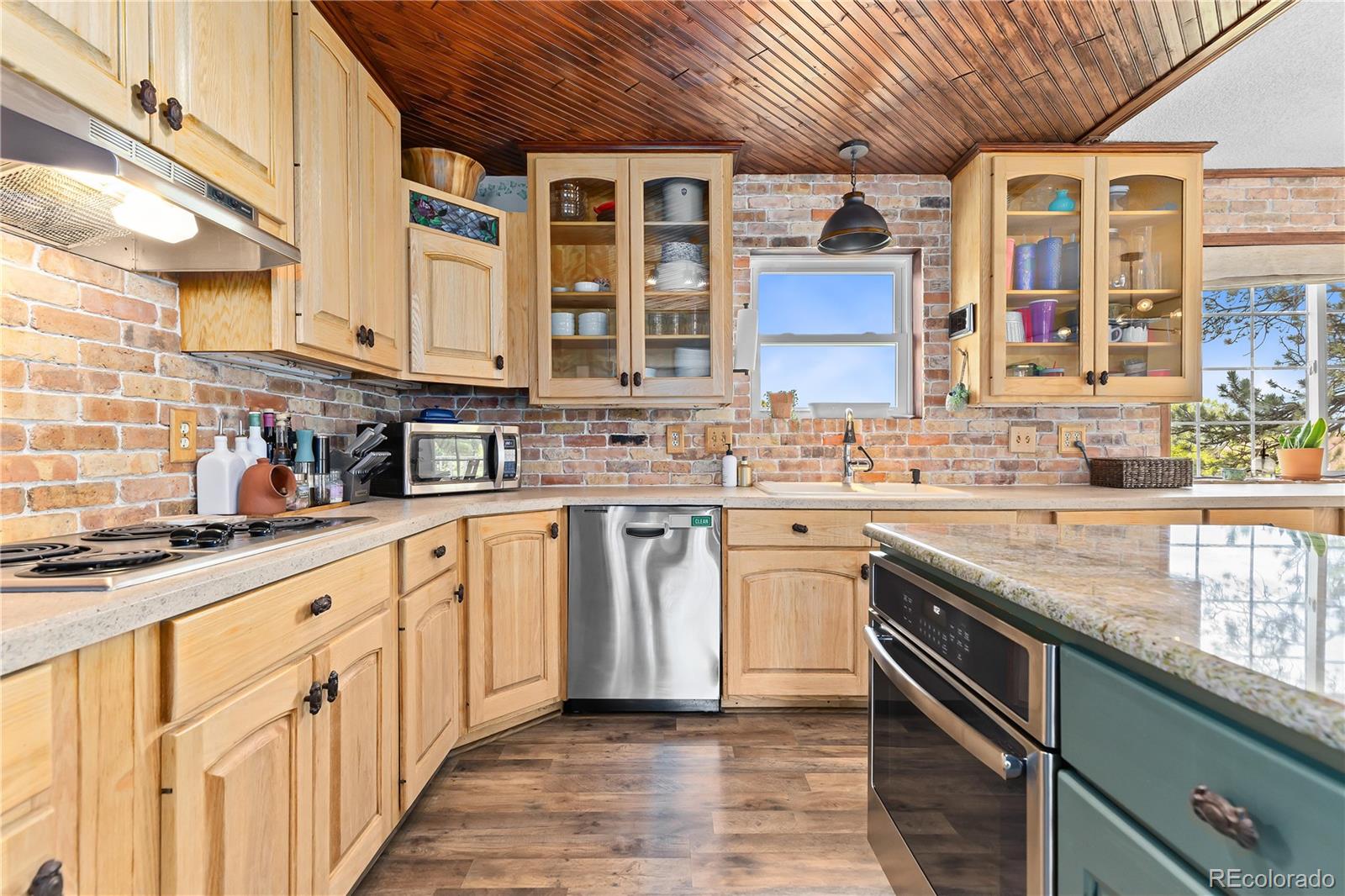 278 Overlook Drive Bailey, CO 80421 - Photo 9 of 37 a kitchen with stainless steel appliances granite countertop a sink and cabinets