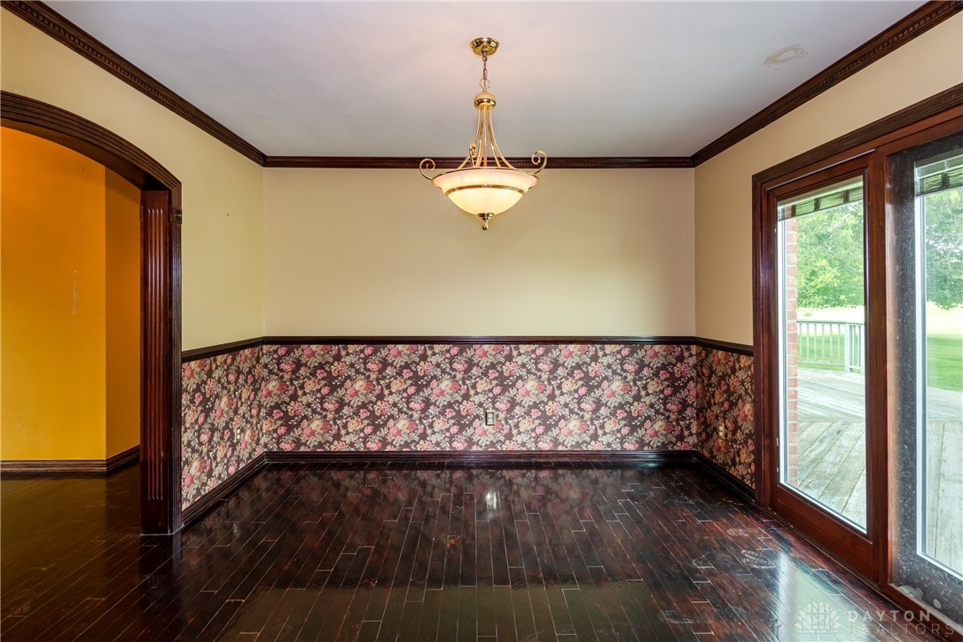 9981 Ridge Acres Lane Englewood, OH 45322 - Photo 13 of 73 This versatile space features rich hardwood flooring and convenient exterior access.