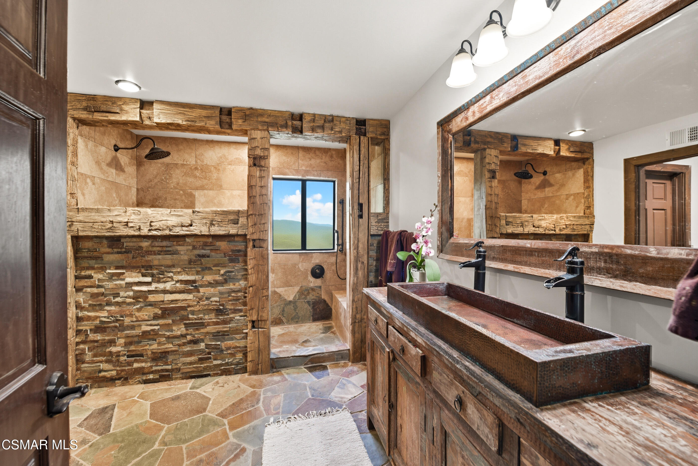 4351 Cornell Road Agoura Hills, CA 91301 - Photo 15 of 33 a bathroom with a sink a mirror and a shower