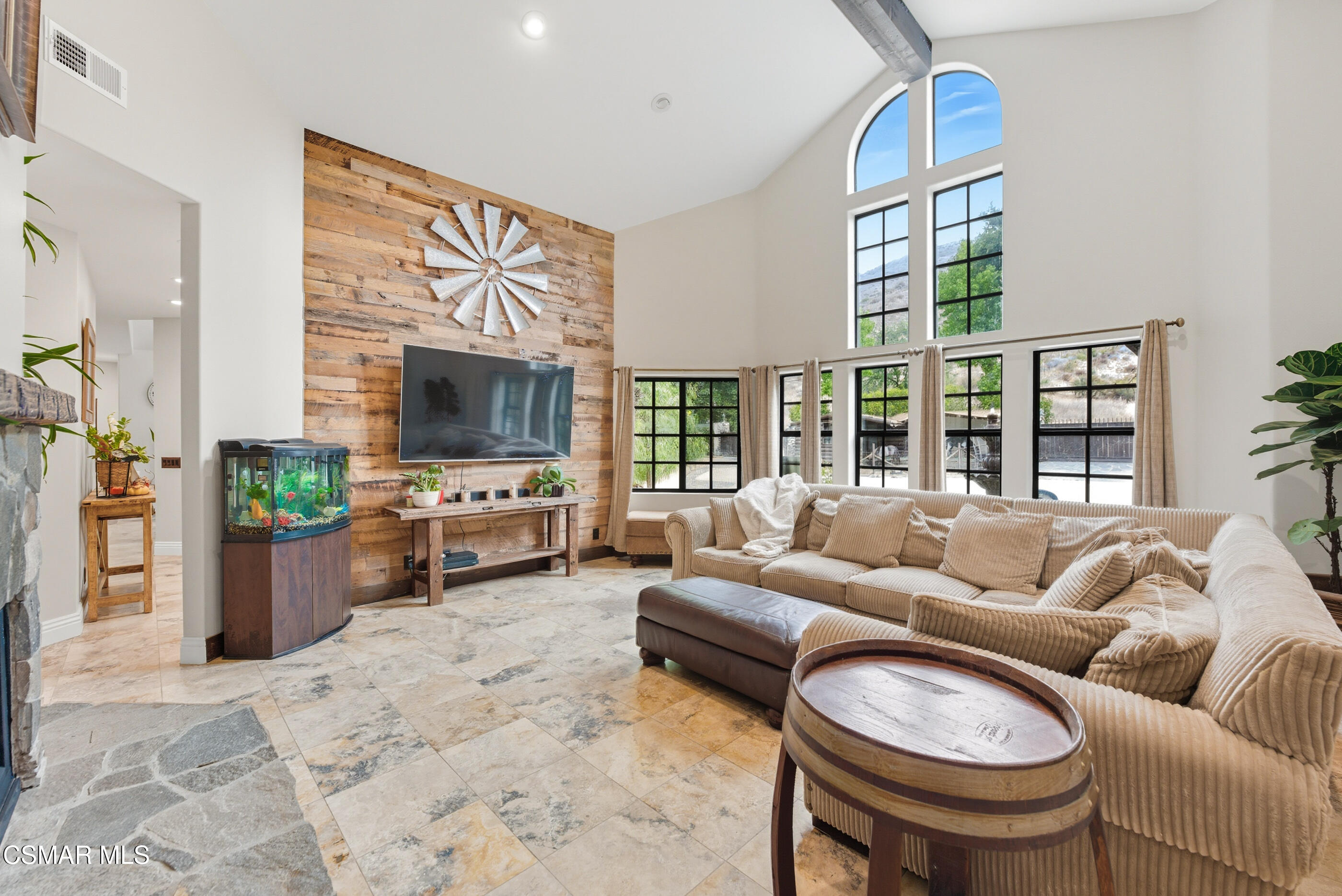 4351 Cornell Road Agoura Hills, CA 91301 - Photo 2 of 33 a living room with furniture and a flat screen tv