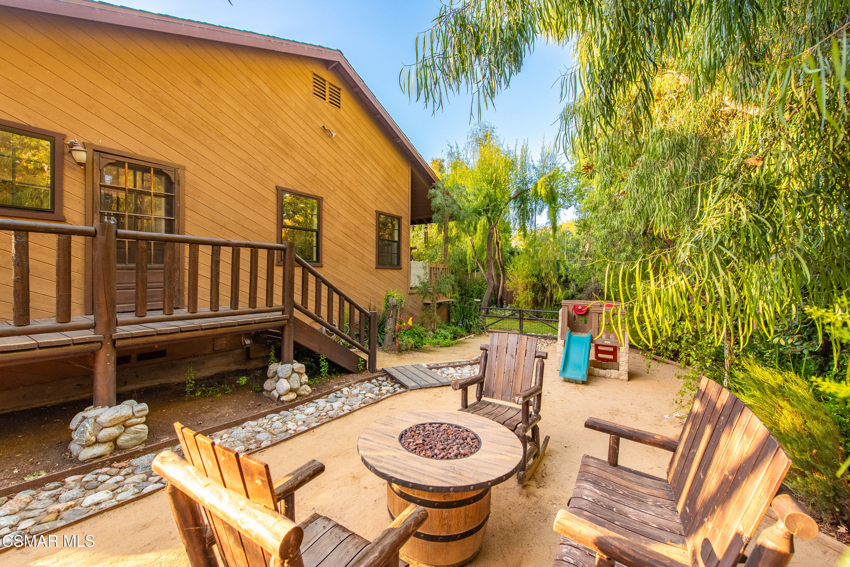 4351 Cornell Road Agoura Hills, CA 91301 - Photo 21 of 33 a view of a patio with table and chairs and potted plants with wooden floor and fence