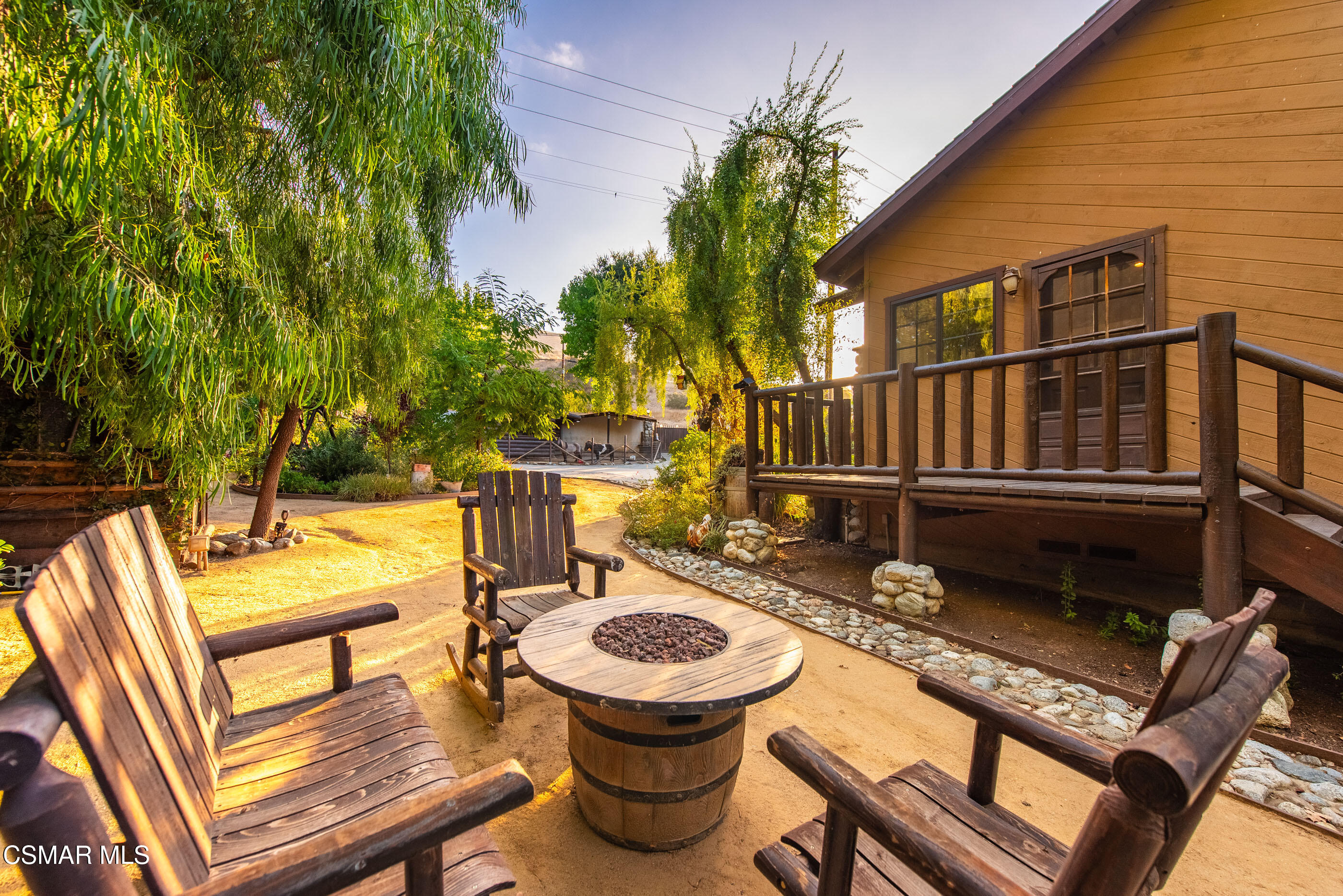 4351 Cornell Road Agoura Hills, CA 91301 - Photo 22 of 33 a view of a balcony with chairs and a barbeque
