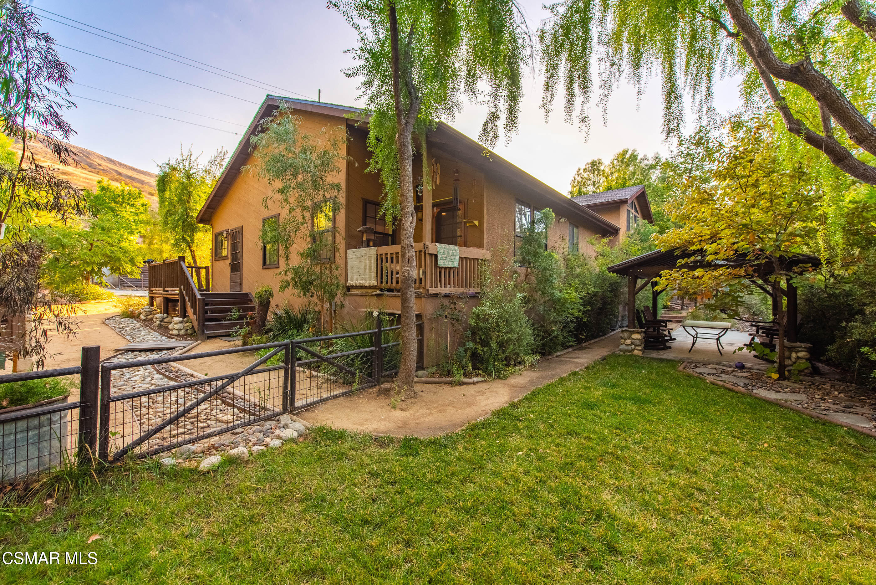 4351 Cornell Road Agoura Hills, CA 91301 - Photo 24 of 33 a view of a house with a back yard