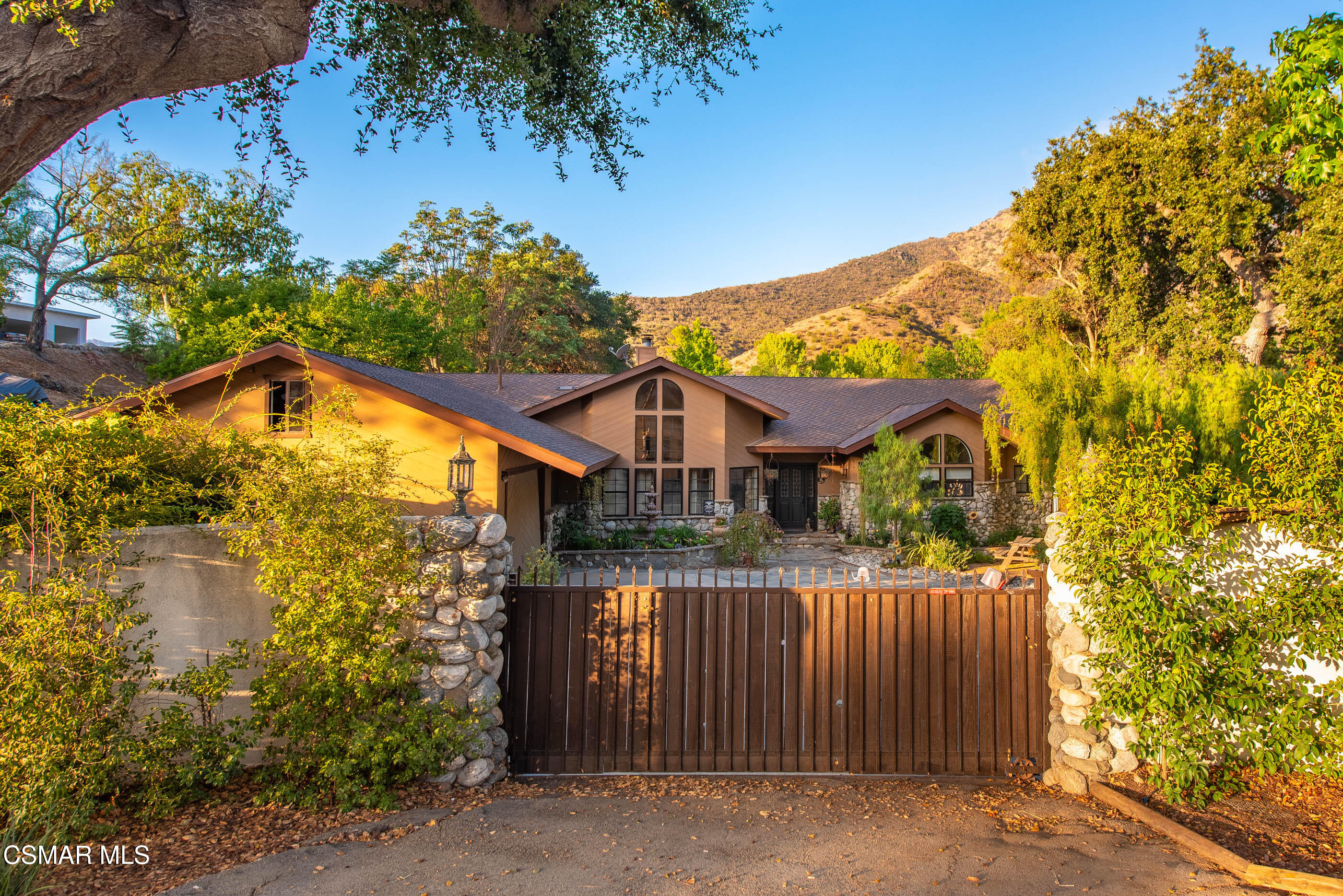 4351 Cornell Road Agoura Hills, CA 91301 - Photo 33 of 33 a front view of a house with a garden