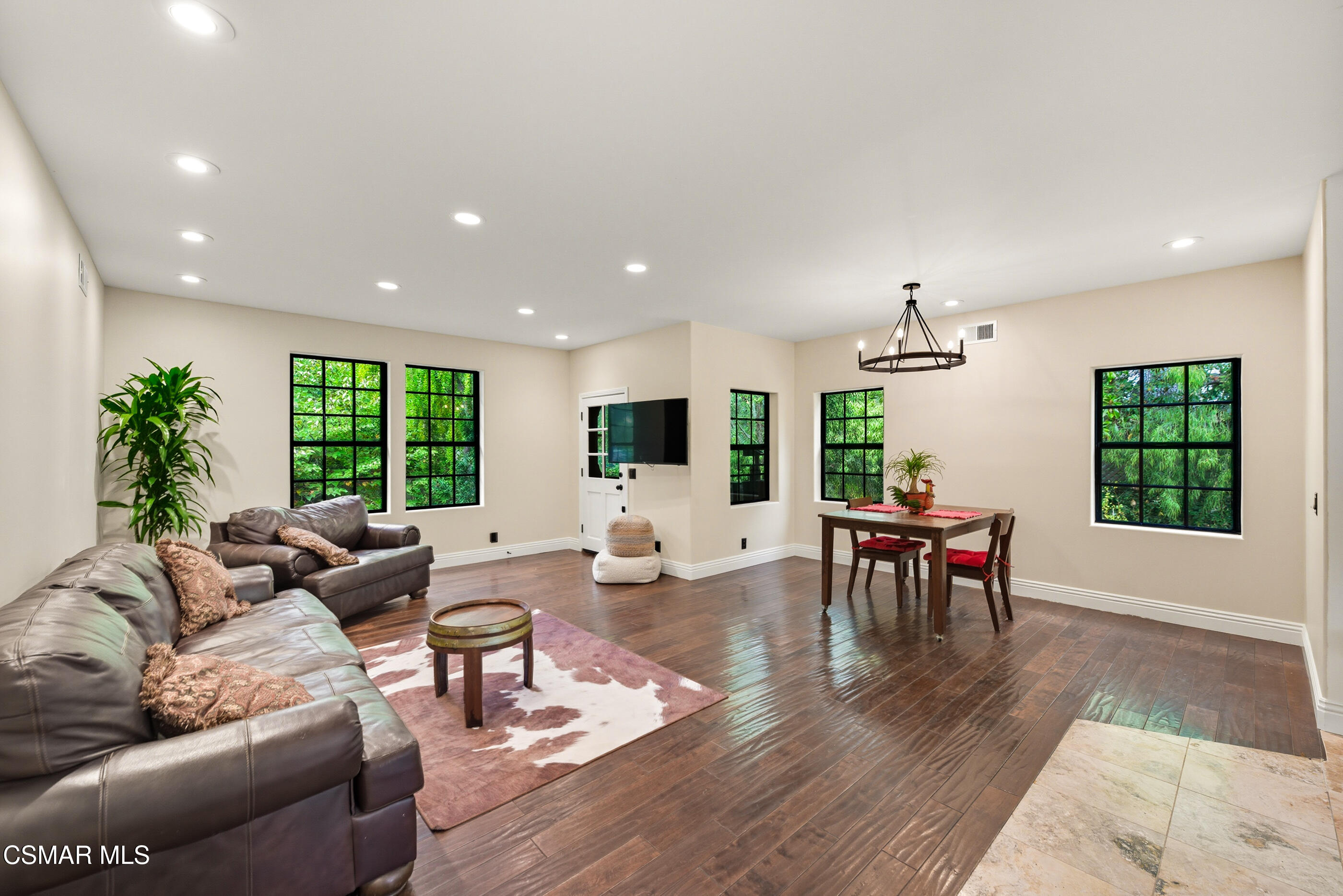 4351 Cornell Road Agoura Hills, CA 91301 - Photo 4 of 33 a living room with furniture flat screen tv and a large window