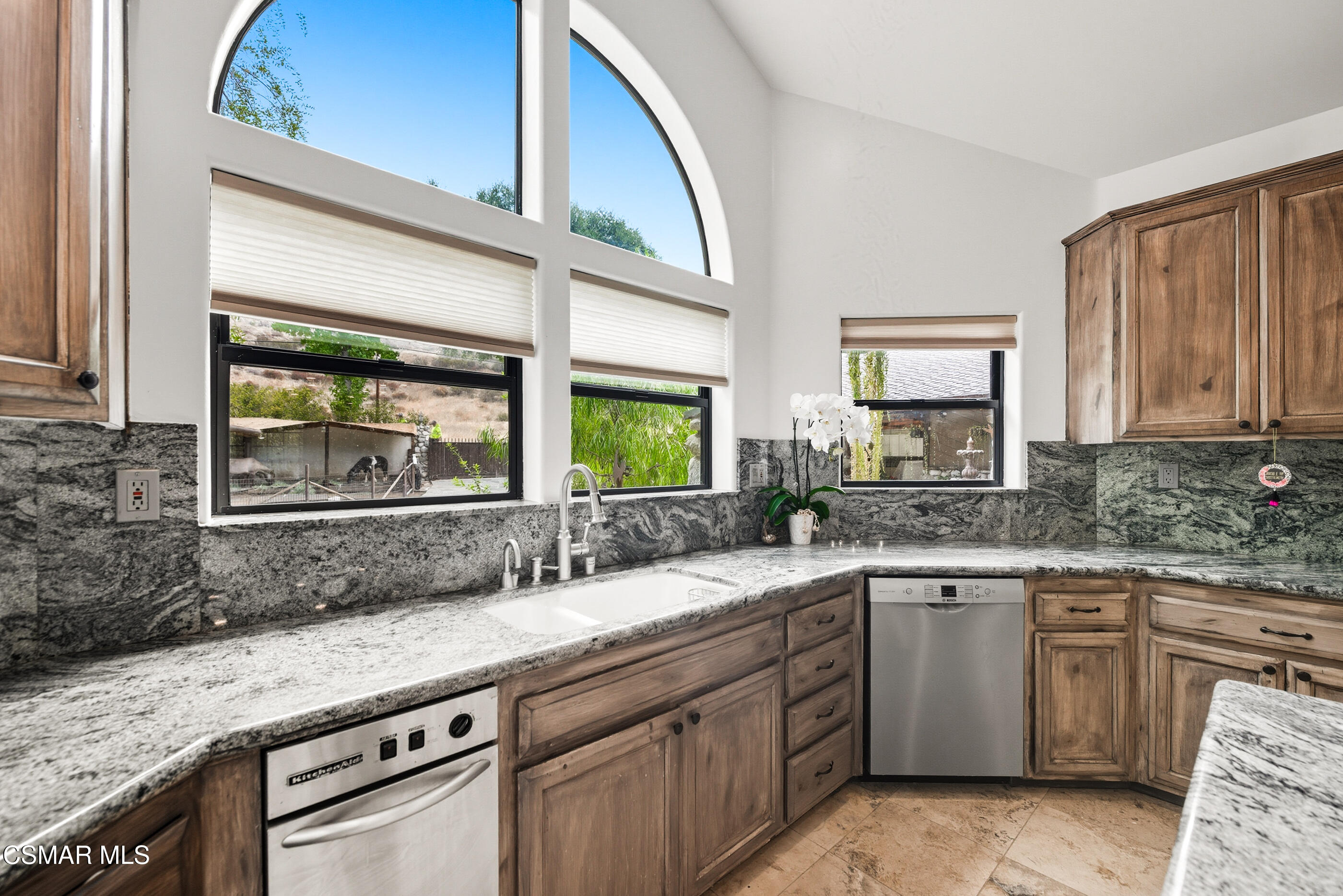 4351 Cornell Road Agoura Hills, CA 91301 - Photo 8 of 33 a kitchen with stainless steel appliances granite countertop a sink stove and cabinets
