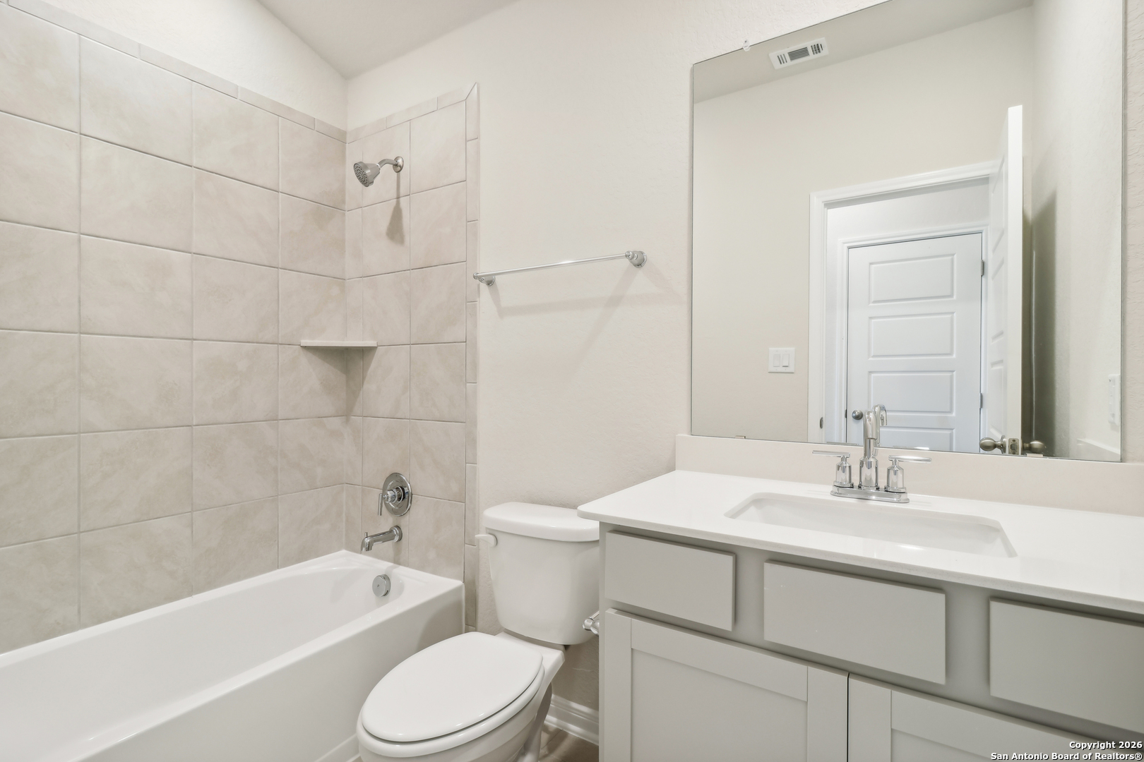 2907 Junction Bay Converse, TX 78109 - Photo 15 of 21 a bathroom with a sink toilet vanity and bathtub