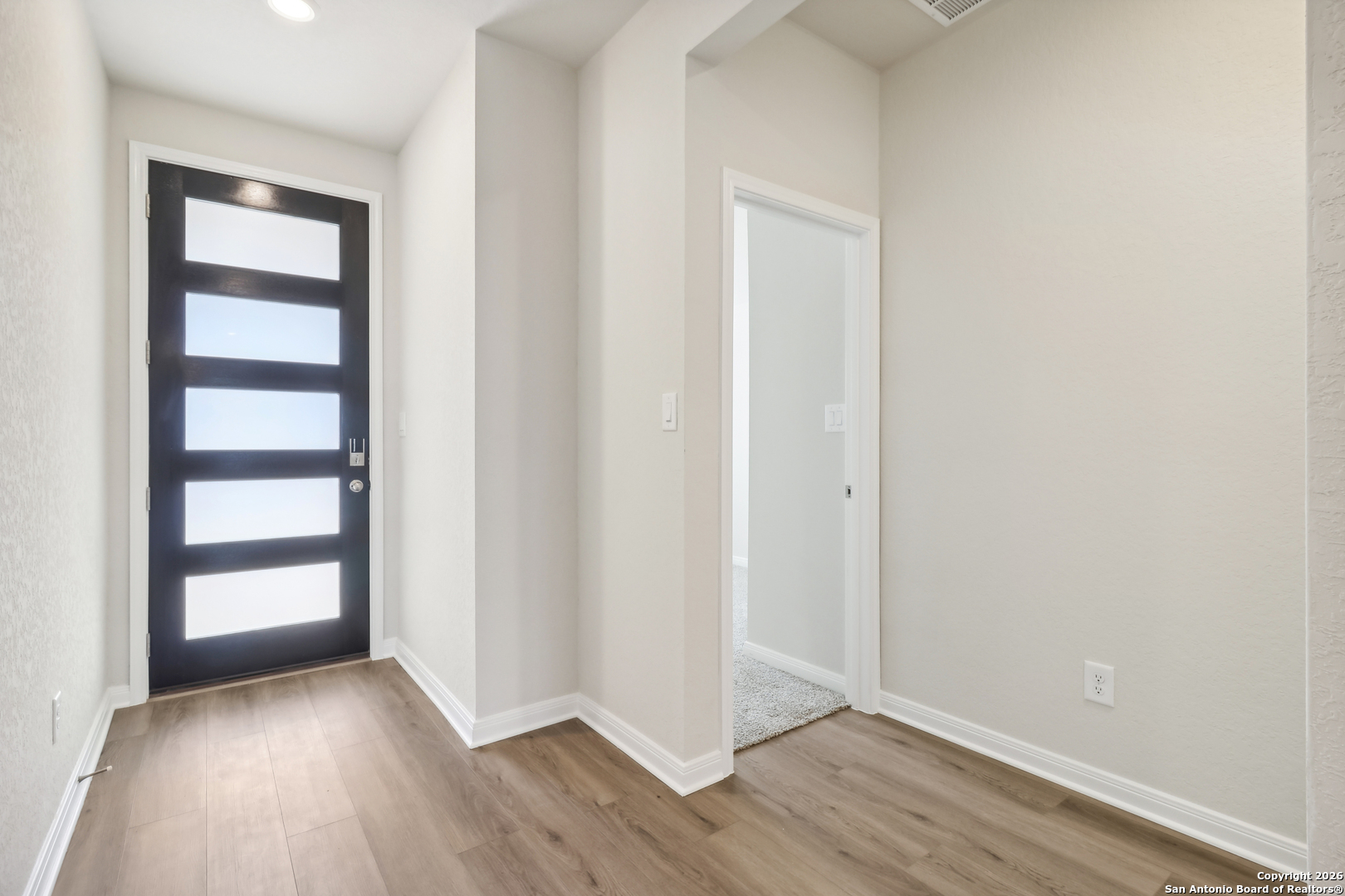 2907 Junction Bay Converse, TX 78109 - Photo 4 of 21 a view of wooden floor and windows in a room