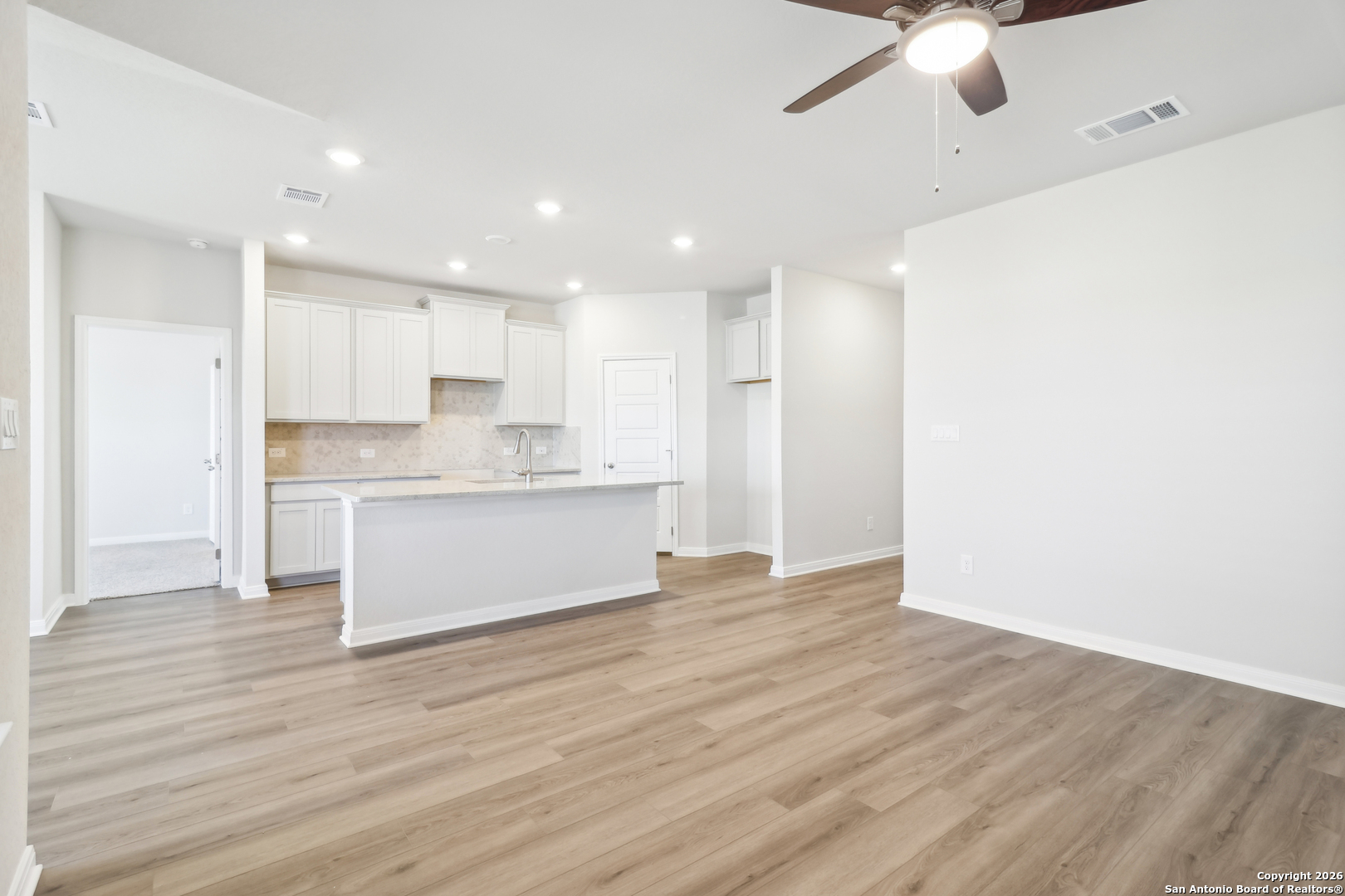 2907 Junction Bay Converse, TX 78109 - Photo 7 of 21 a view of kitchen with granite countertop cabinets and wooden floor